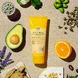 Rcp-10 Anti Hair Loss Treatment Herbal Woody 200ml tube placed upright with its natural herbal ingredients arranged around it