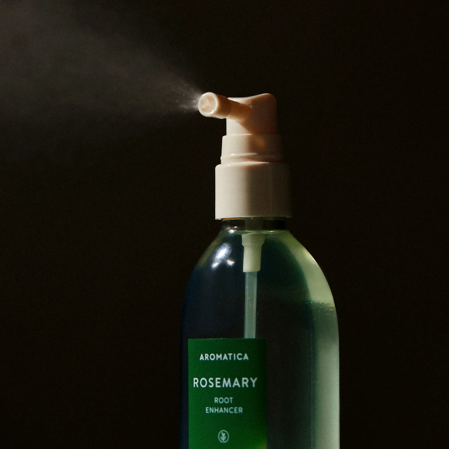 Aromatica Rosemary Root Enhancer being sprayed