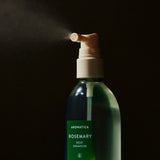 Aromatica Rosemary Root Enhancer being sprayed
