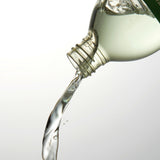 Aromatica Rosemary Root Enhancer product pouring from bottle