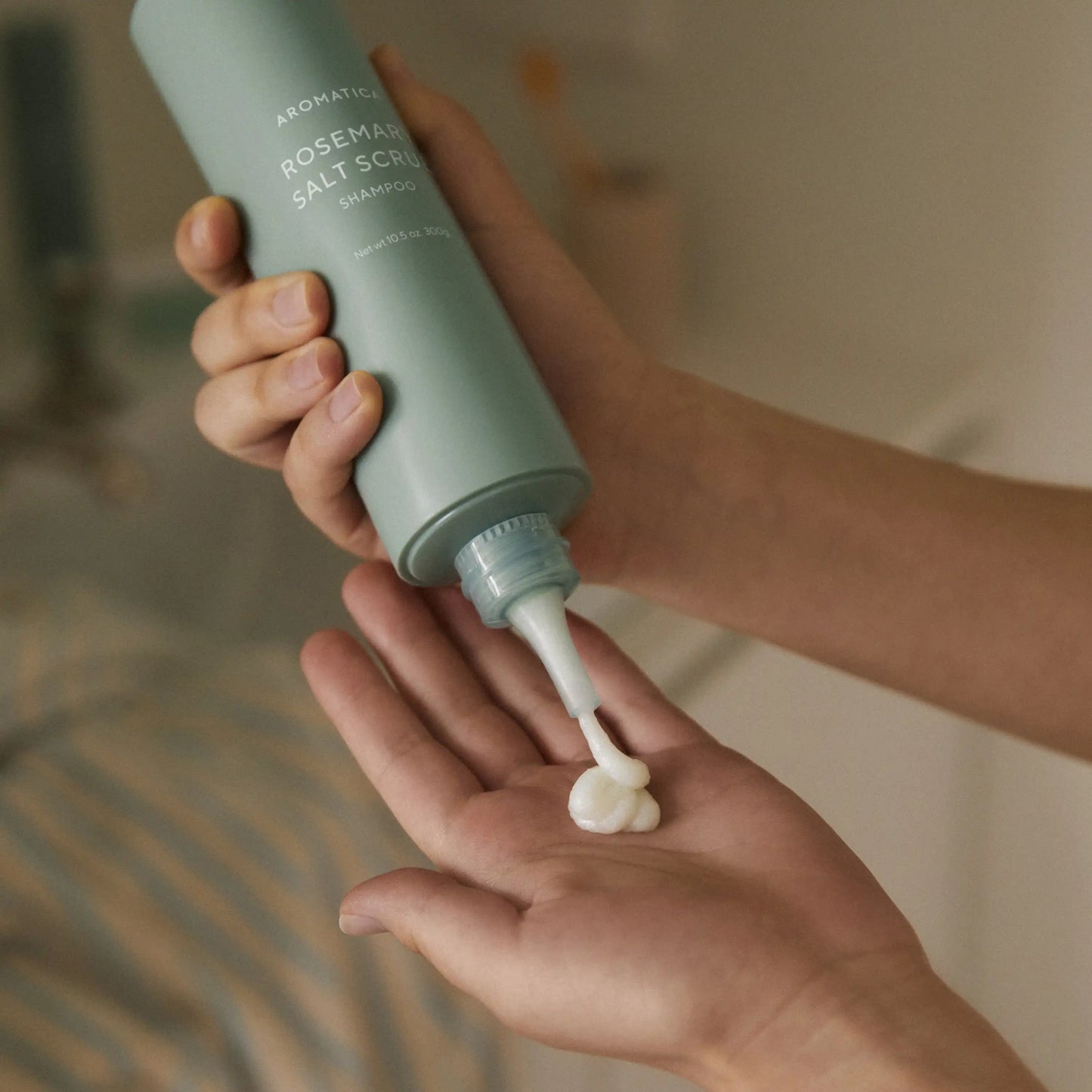 Aromatica Rosemary Salt Scrub Shampoo squeezed from tube showing texture