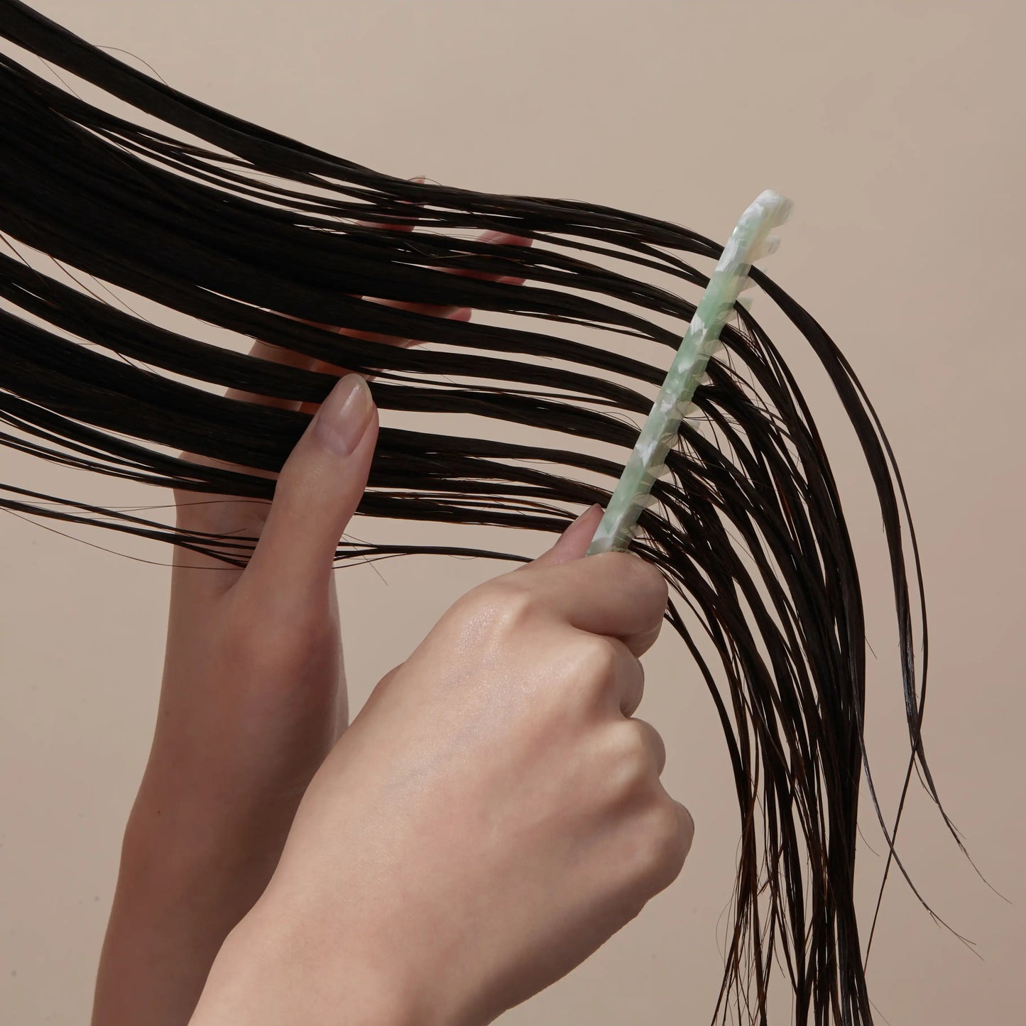 Aromatica Rosemary Scalp 3-in-1 Treatment applied on hair close-up