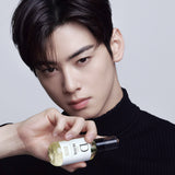 Dashu Pro Airy Polish Hair Oil held in hand by model