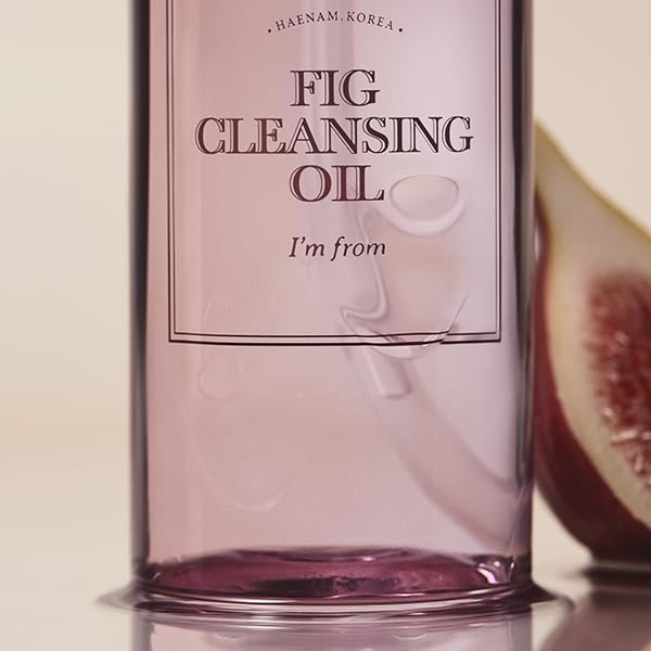 I'm From Fig Cleansing Oil 200ml bottle close-up with fresh figs in background
