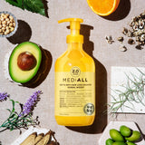 Rcp-10 Anti Hair Loss Shampoo Herbal Woody 300ml bottle placed upright with its natural herbal ingredients arranged around it