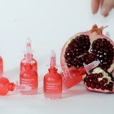 NDP Pomegranate Vitamin C Brightening Ampoule placed in a bright skincare routine setting for glowing skin