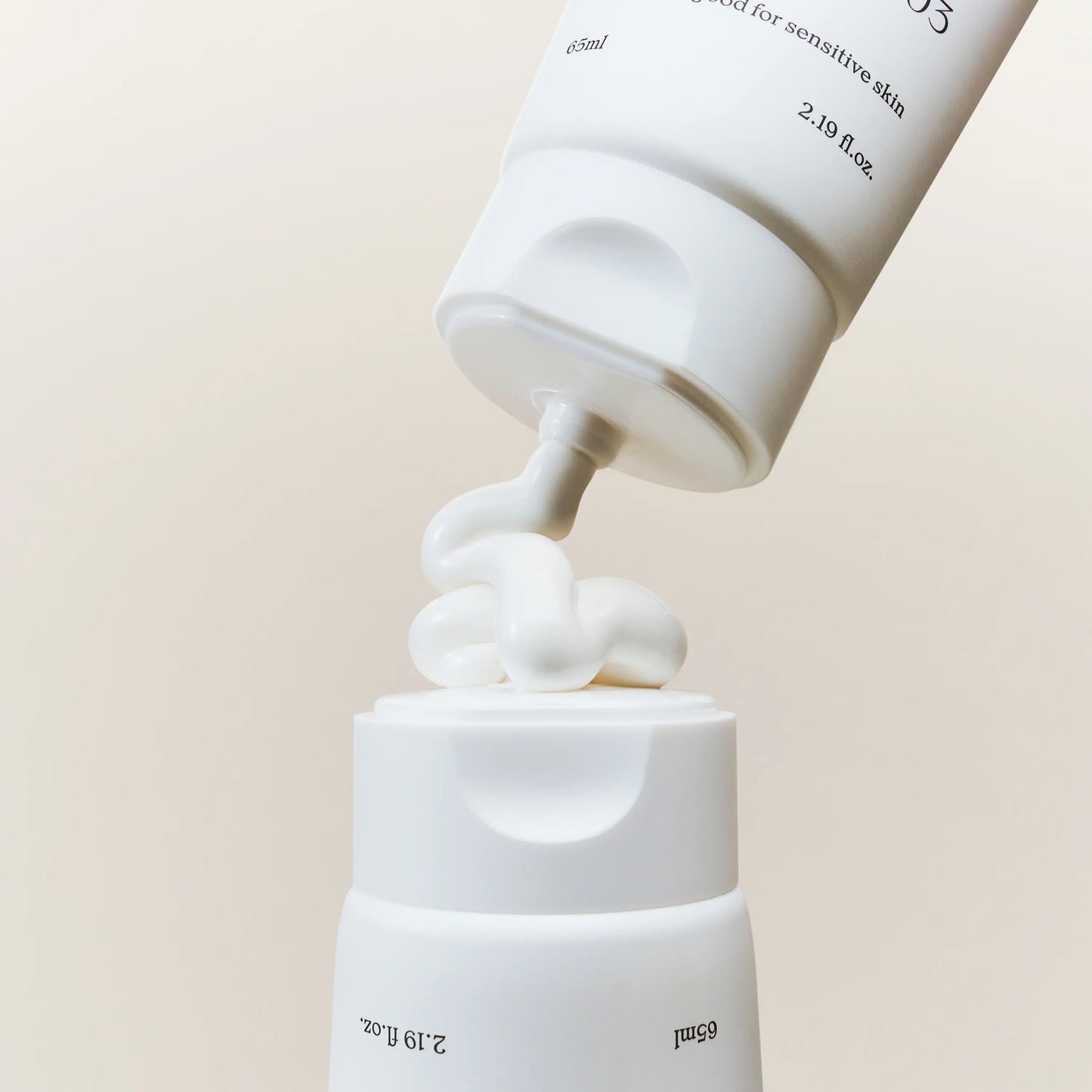 NDP Vitamin B9 Tone-up Cream being dispensed to show lightweight brightening tone-up texture with smooth finish
