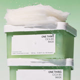 One Thing Cica B5 Mask stacked on two containers