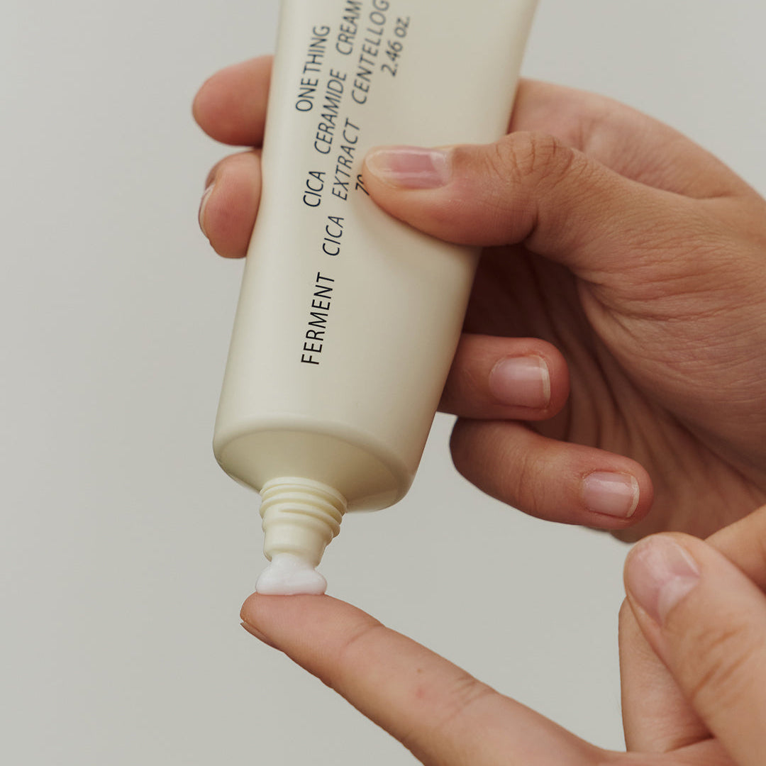 One Thing Cica Ceramide Cream being squeezed onto hand