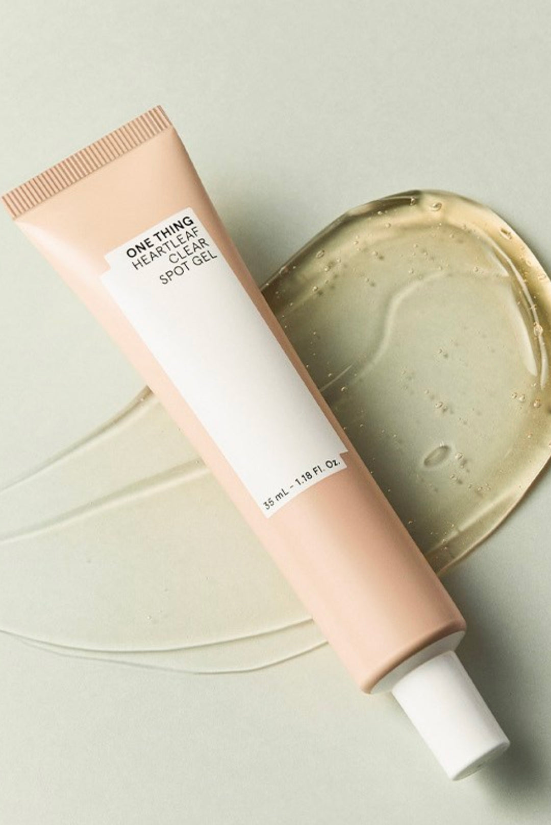 One Thing Heartleaf Clear Spot Gel tube laying with gel texture