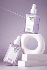 One Thing Peptide Retinal Serum two bottles on purple gradient background