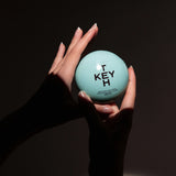 KEYTH Perfumed Hand Cream 70ml in Reptile Disco scent held in hand