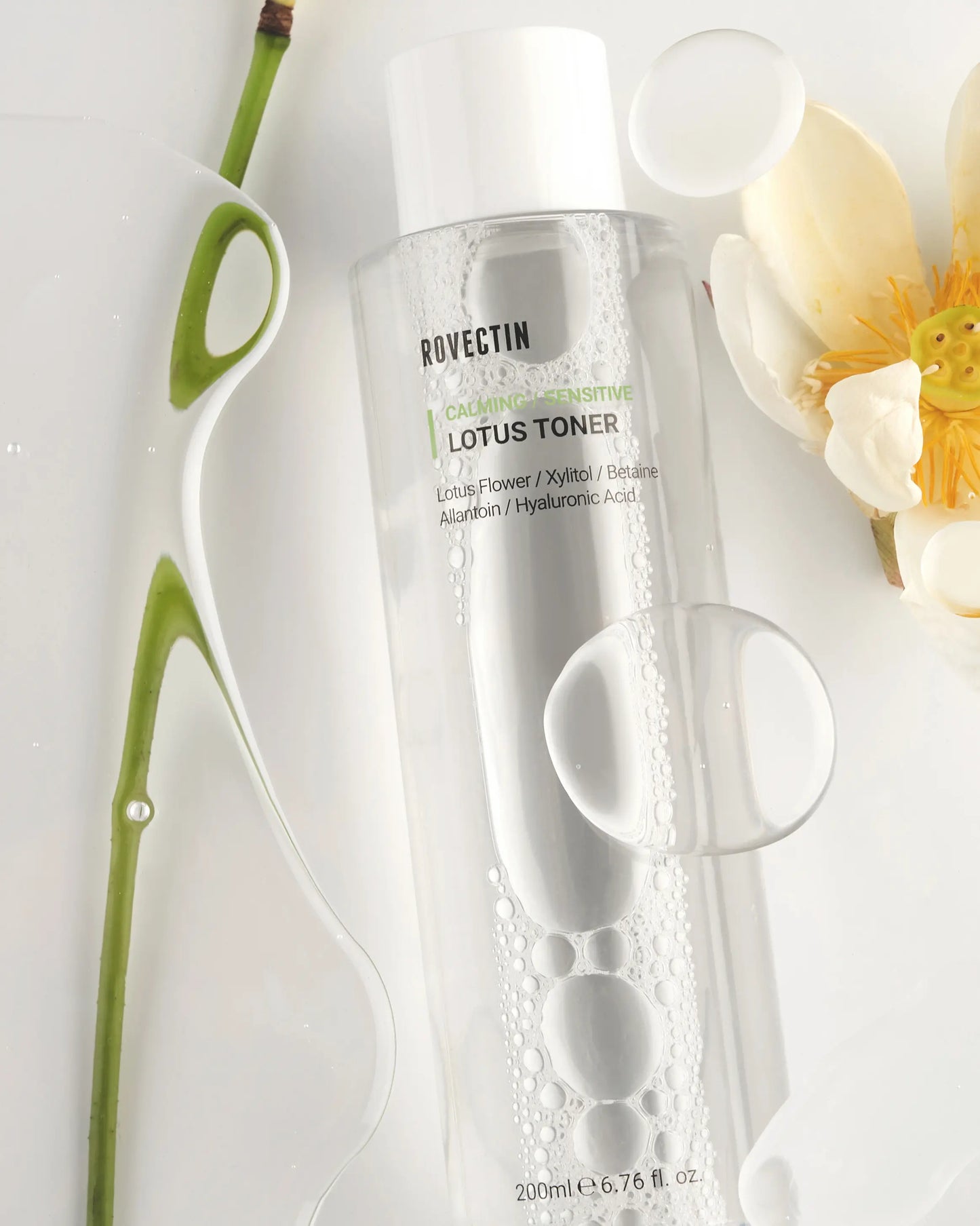 Rovectin Calming Lotus Toner bottle with lotus flowers top view