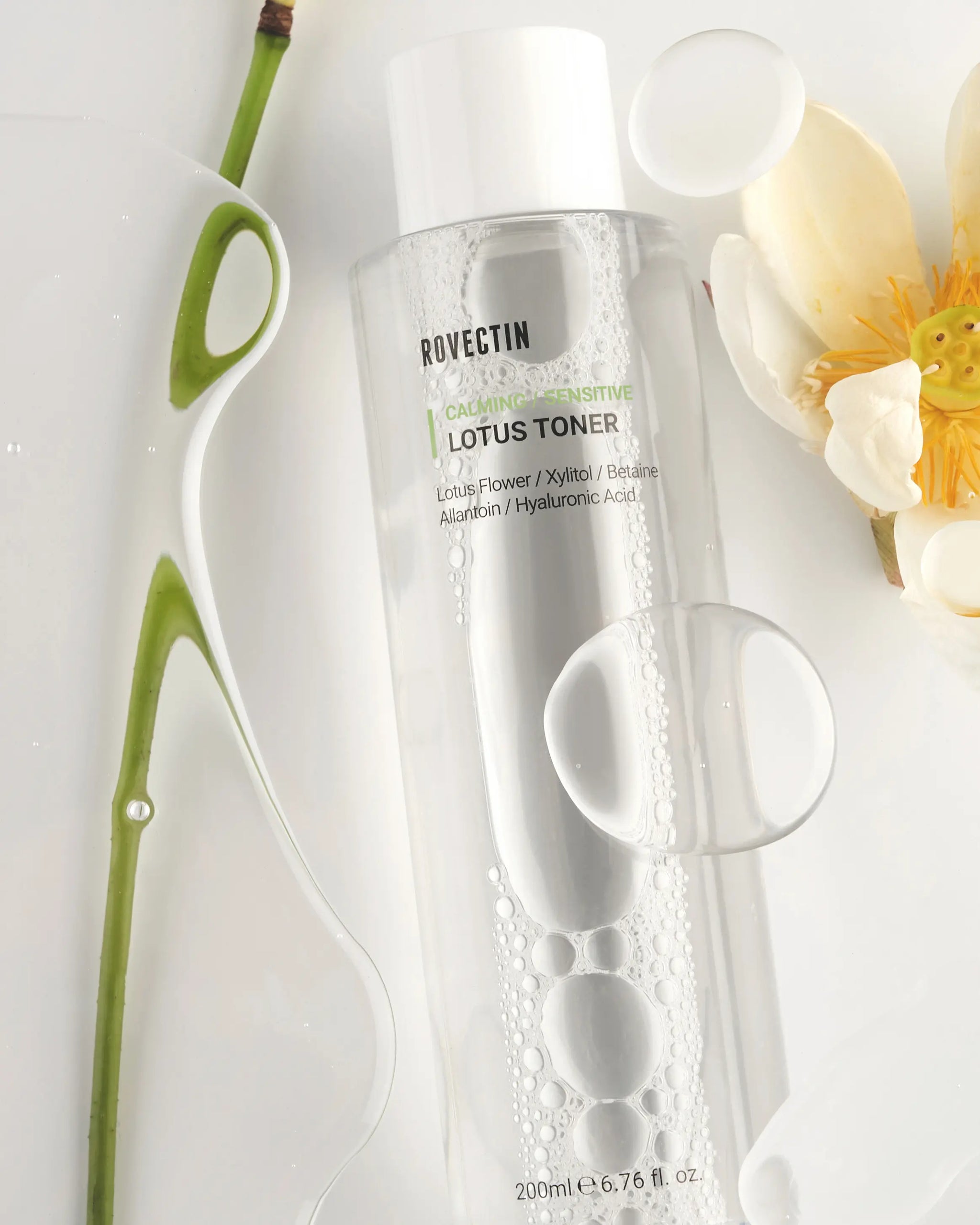 Rovectin Calming Lotus Toner bottle with lotus flowers top view