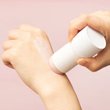 SKIN1004 Madagascar Centella Poremizing Quick Clay Stick Mask being applied on back of hand