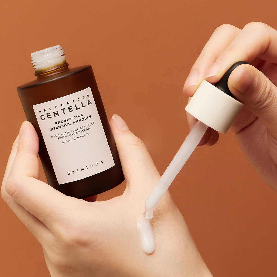 SKIN1004 Madagascar Centella Probio-Cica Intensive Ampoule dispensed onto hand with dropper