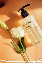 Skybottle Perfumed Body Wash White Rain 300ml bottle with white roses in background