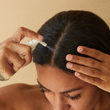 Aromatica Tea Tree Purifying Tonic being sprayed on scalp